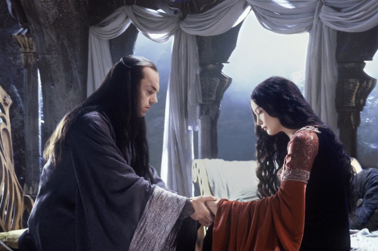 Elrond (Hugo Weaving) comforts daughter Arwen